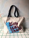 The "But Mostly I Like Cats" Shopping & Beach Bag by Bags by diedododa features a cotton canvas design with black handles, a blue cat graphic, and the bold red phrase "But mostly I like snacks," making it an ideal tote for snack lovers.