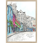 Essential Edinburgh's Victoria Street Matte Art Print captures a vibrant, curved city street with colorful buildings and shopfronts—ideal wall art for adding a unique Edinburgh touch to your space.