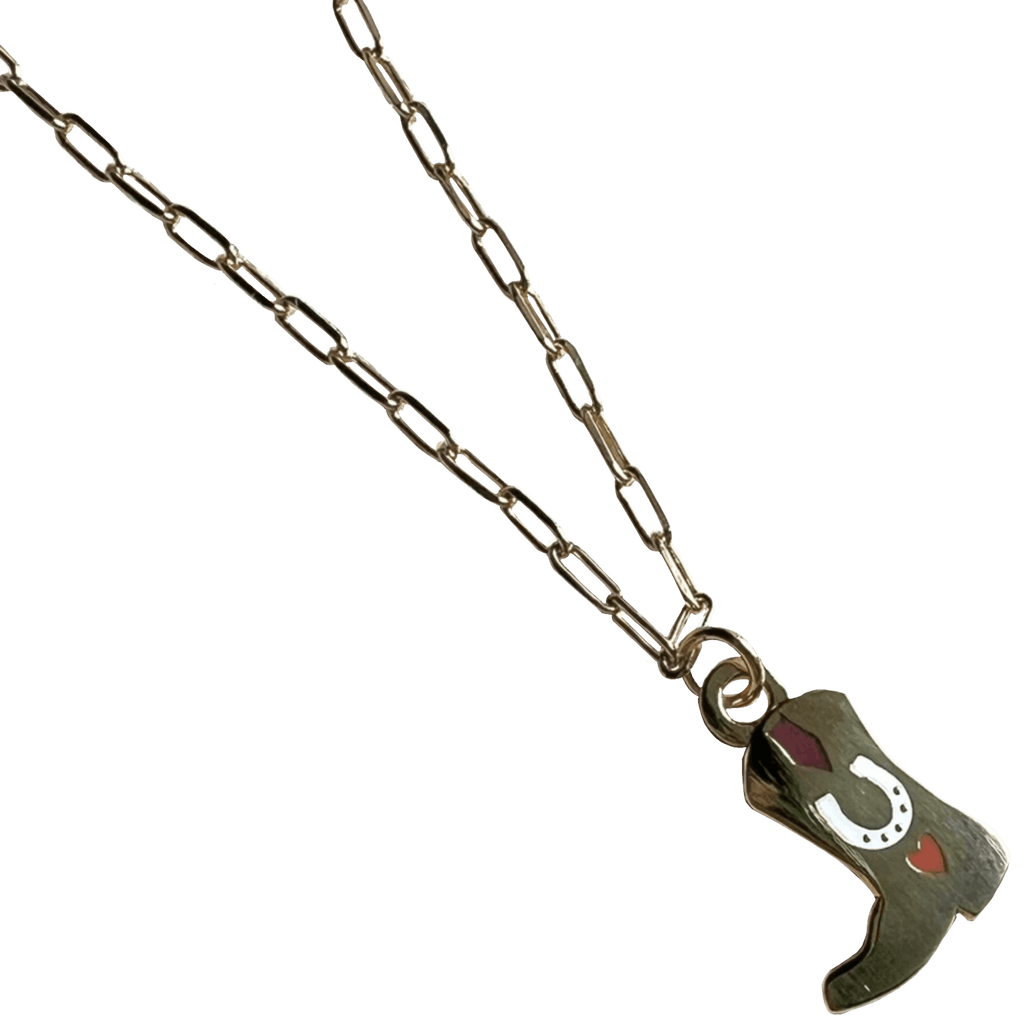 The Tiny Tootin Bootin Necklace by Necklaces is a silver paperclip necklace featuring a cowboy boots pendant, elegantly adorned with a horseshoe and heart design.