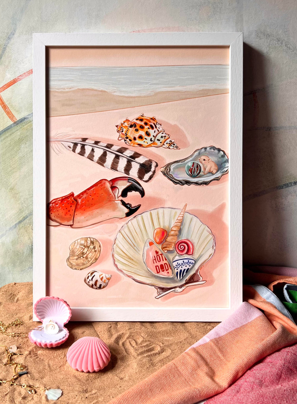 The Tiny Treasures Giclée Art Print by Hôtel Dodo captures a collection of seashells and beach items resting on sand, including a feather, a shell with a pearl, a lobster claw, and dessert on a shell. This artwork invites you to embark on mind travel as if you're lounging at Hôtel Dodo, with shimmers of sea glass adding a touch of oceanic charm.