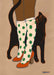 The "Encounters of the Purred Kind I Matte Art Print" by Encounters of the Purred Kind depicts a lucky black cat nuzzling green polka dot knee-high socks and red heels, spreading good tidings with each affectionate touch.