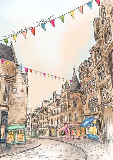 Cockburn Street Edinburgh Art Print by Essential Edinburgh features a picturesque street scene with historic architecture, vibrant shopfronts, and cheerful bunting hanging above. The sky is clear, and the streets are beautifully cobblestoned.